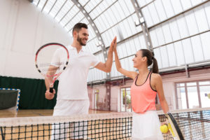 couple playing tennis